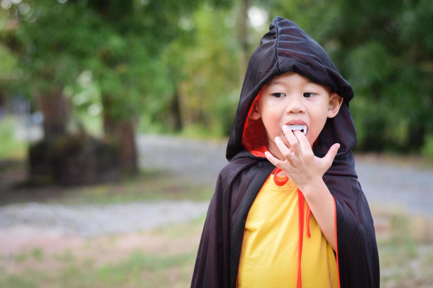 Happy kid in halloween costumes. halloween holiday concept photo