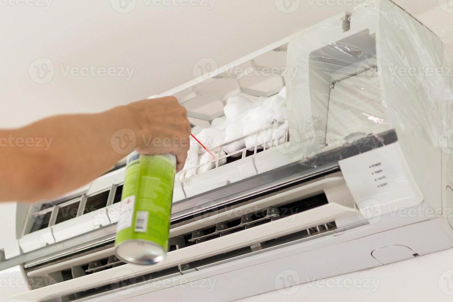 air conditioner cleaning with spray foam cleaner photo