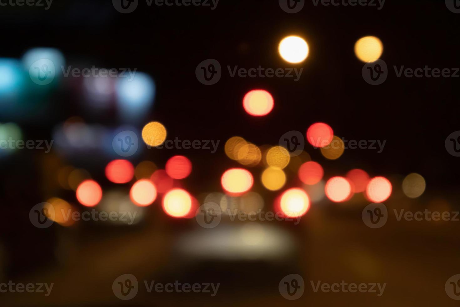 Abstract night traffic blur background with bokeh light photo