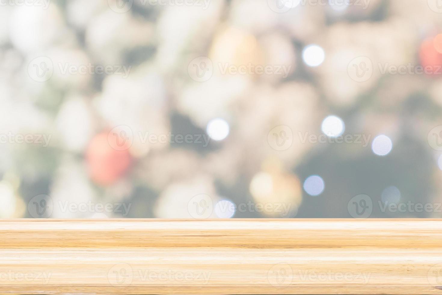 Empty wood table top with Abstract blur Christmas tree with decoration bokeh light background for product display photo