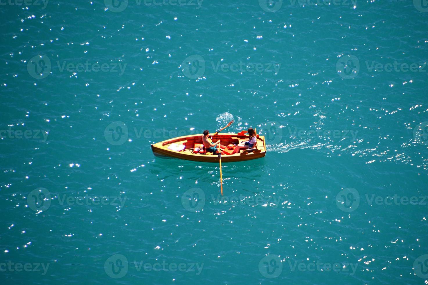 boat on the blue water photo