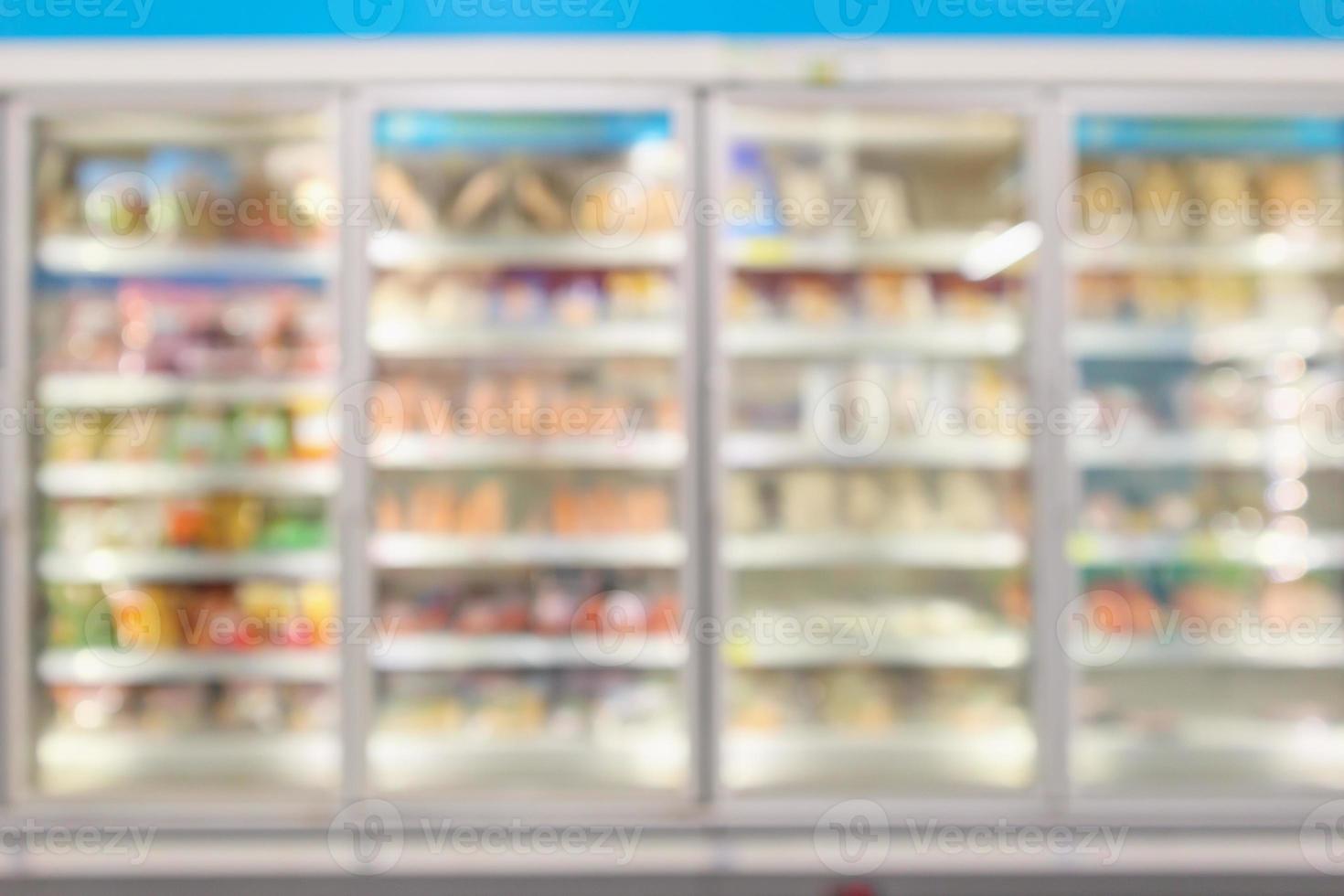 supermarket commercial refrigerators freezer showing frozen foods abstract blur background photo