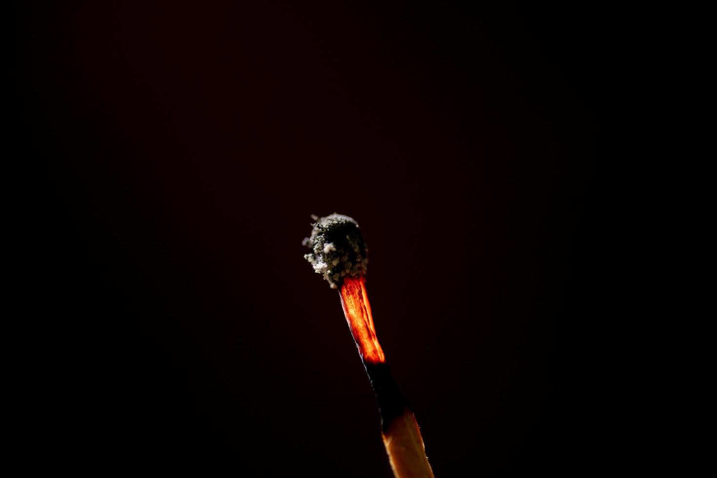 Smoke from burning matchsticks on a black background photo