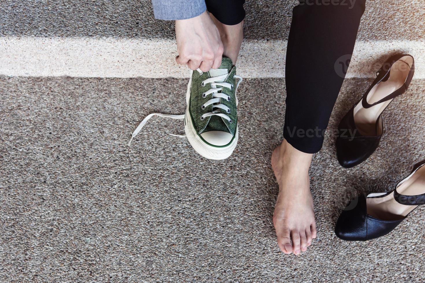 Health Care concept. Barefoot Business Woman sitting at stair to