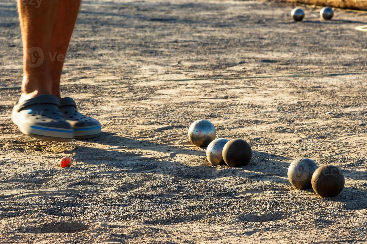 Game of petanque on the ground. Horizontal image. photo
