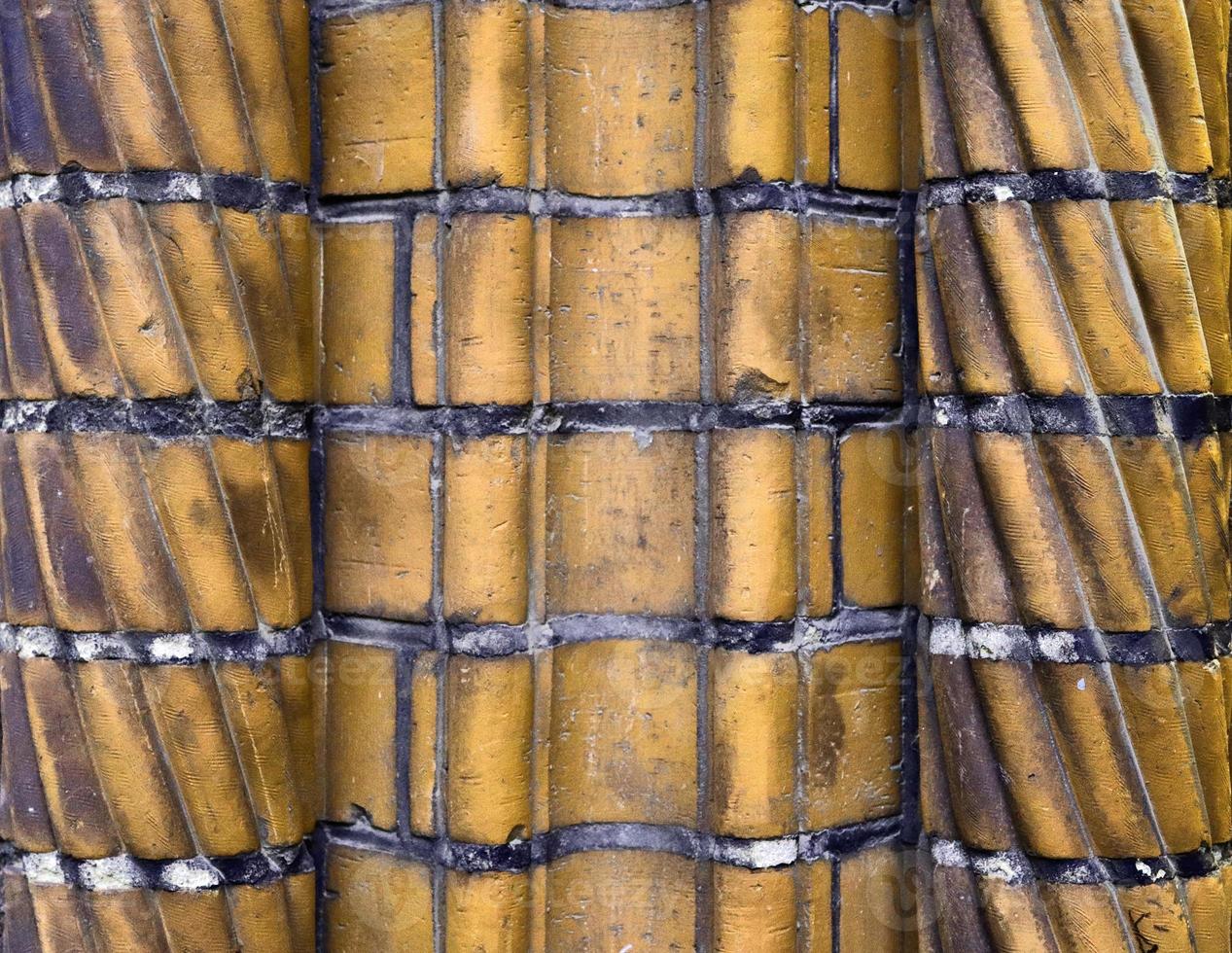 Detailed view at a colorful old and weathered brick wall texture as a panoramic background. photo