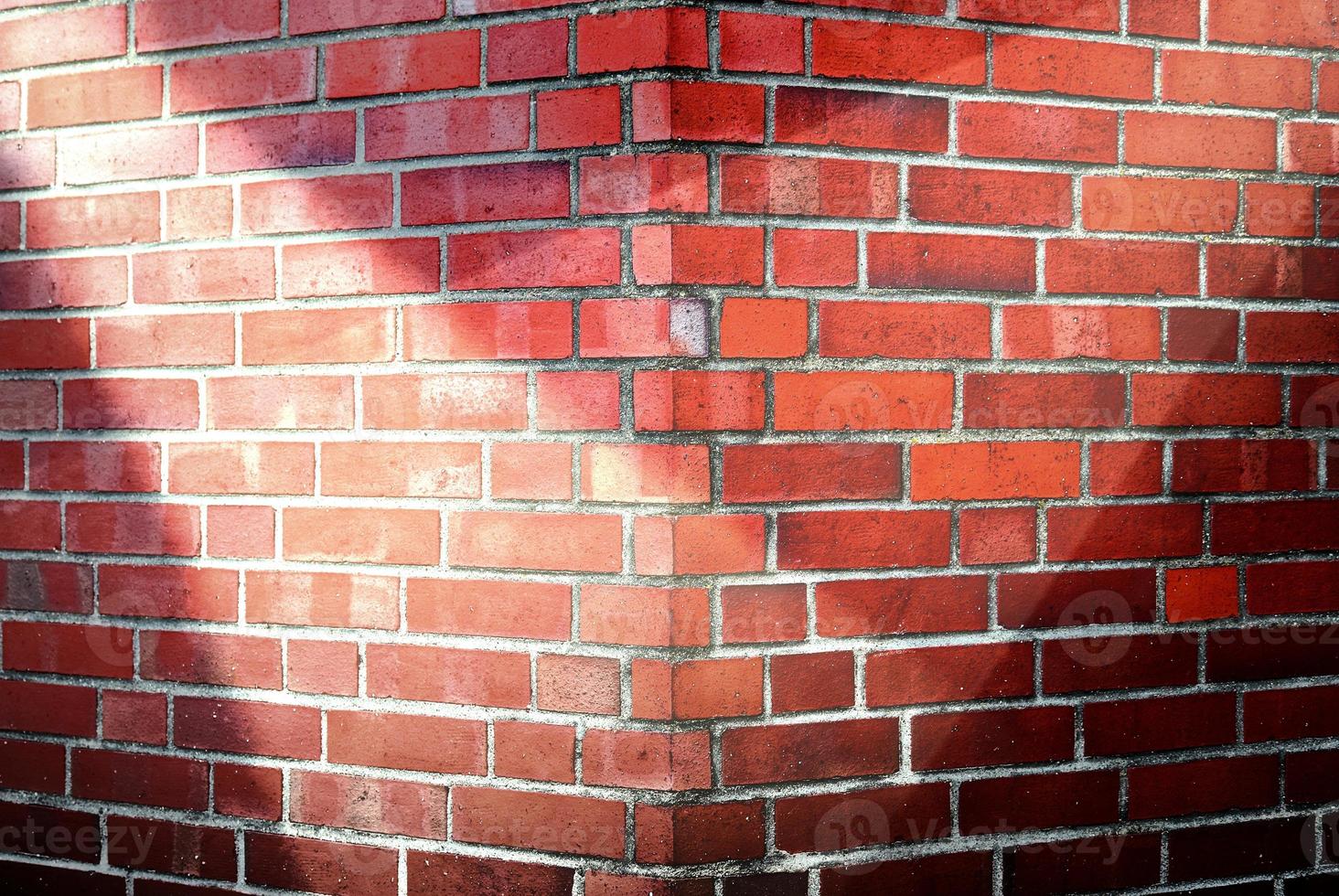 Aged and weathered brick wall textures with very bright spotlight illumination photo