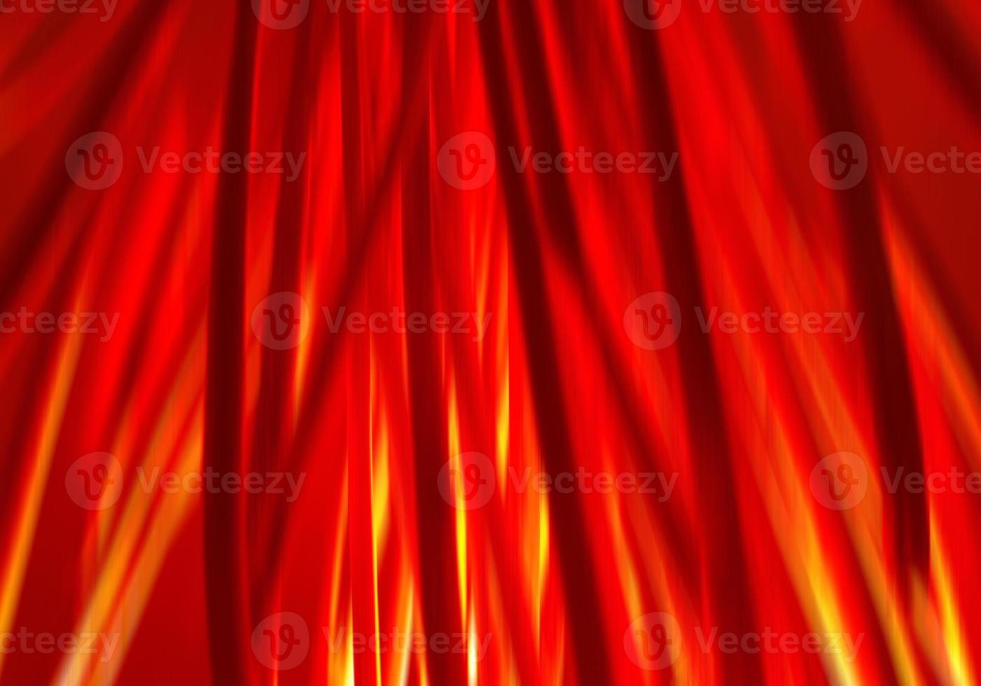 Motion blur defocused abstract Halloween background. Bundle of hay or straw or brushwood or sticks backlighted by red lamp like a fire. Dark red and orange vertical lines. photo