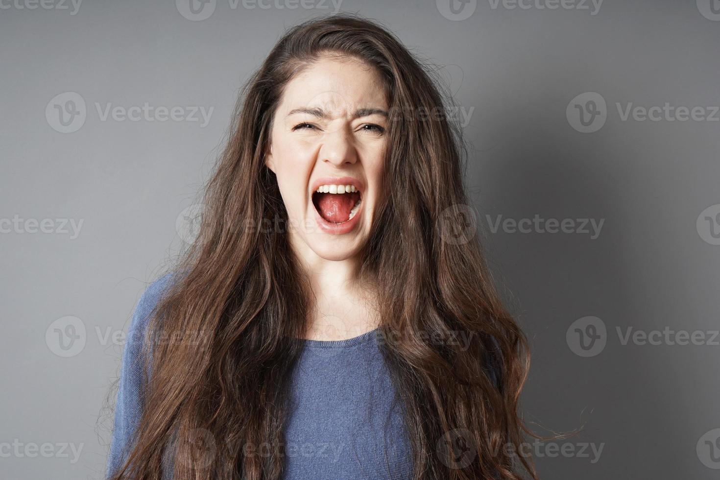 angry young woman screaming and shouting photo