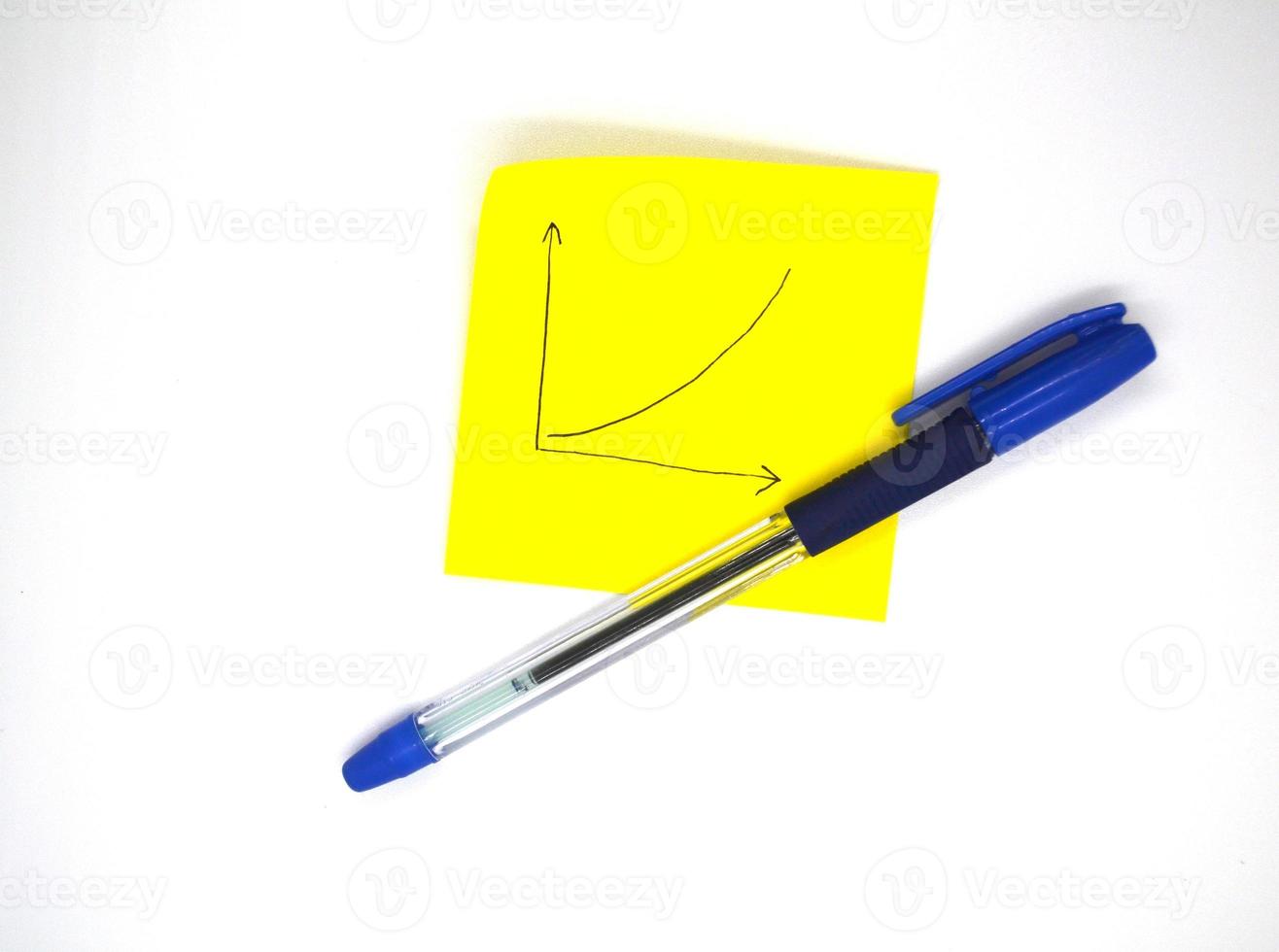 A pen and a piece of paper with a chart. photo