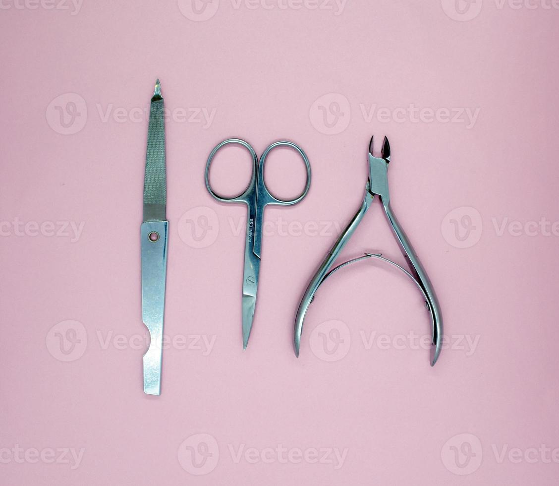 Nail file, scissors and nail clippers photo