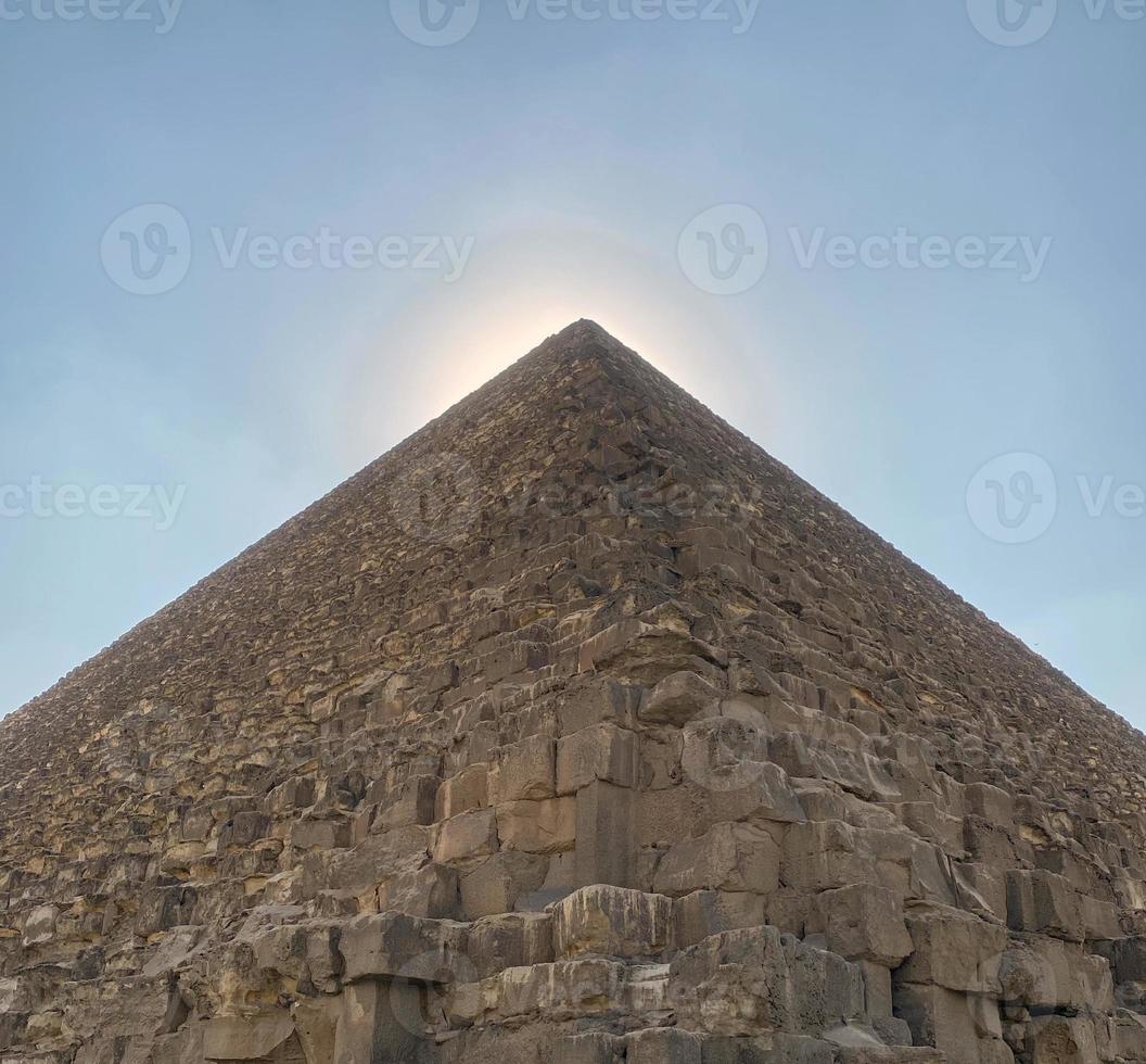 Egyptian pyramid. Pictured is an Egyptian pyramid against a blue sky. photo