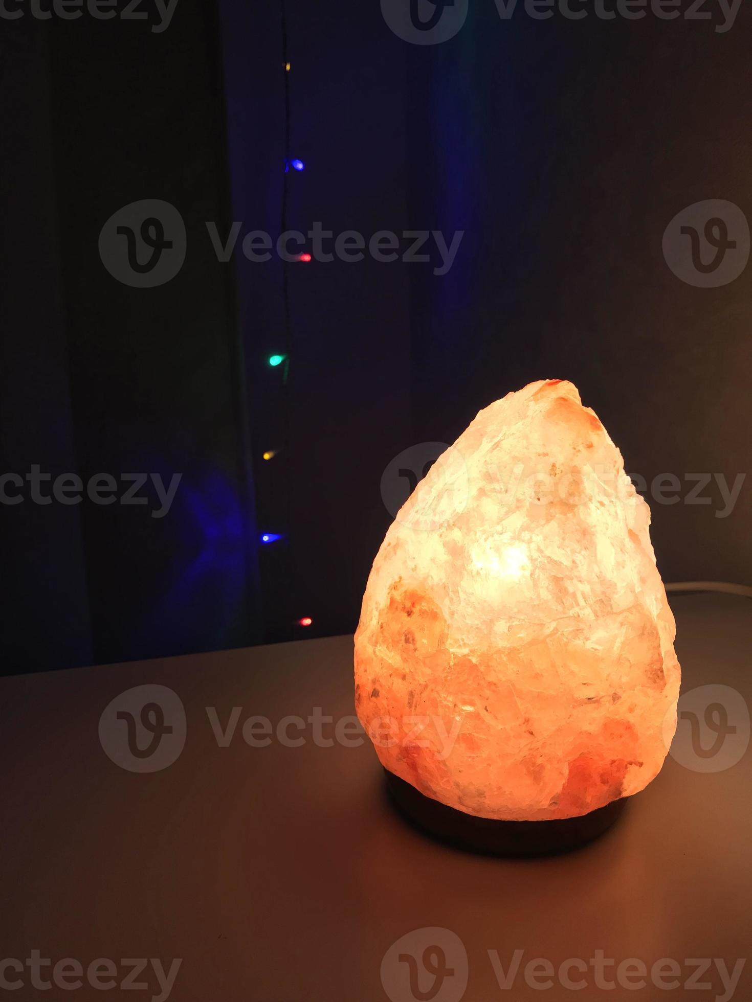 Salt lamp. The photo shows a salt lamp, a night house and a light