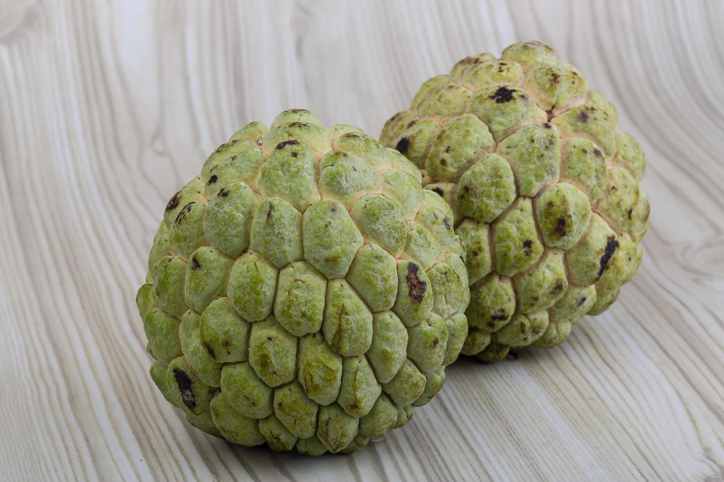 Custard apple on wood photo