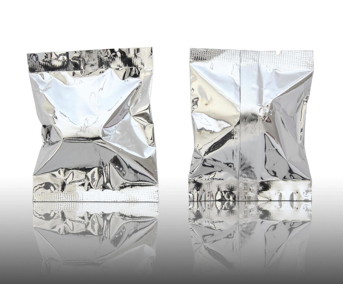 Foil package on reflect floor and white background photo