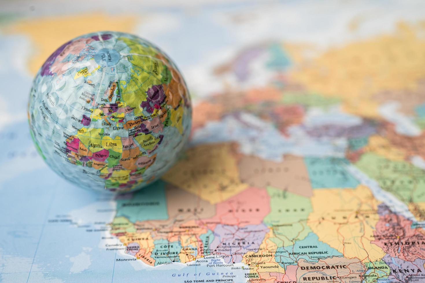 Bangkok, Thailand, May 1, 2021 Africa map at golf ball with flag on world globe map. photo