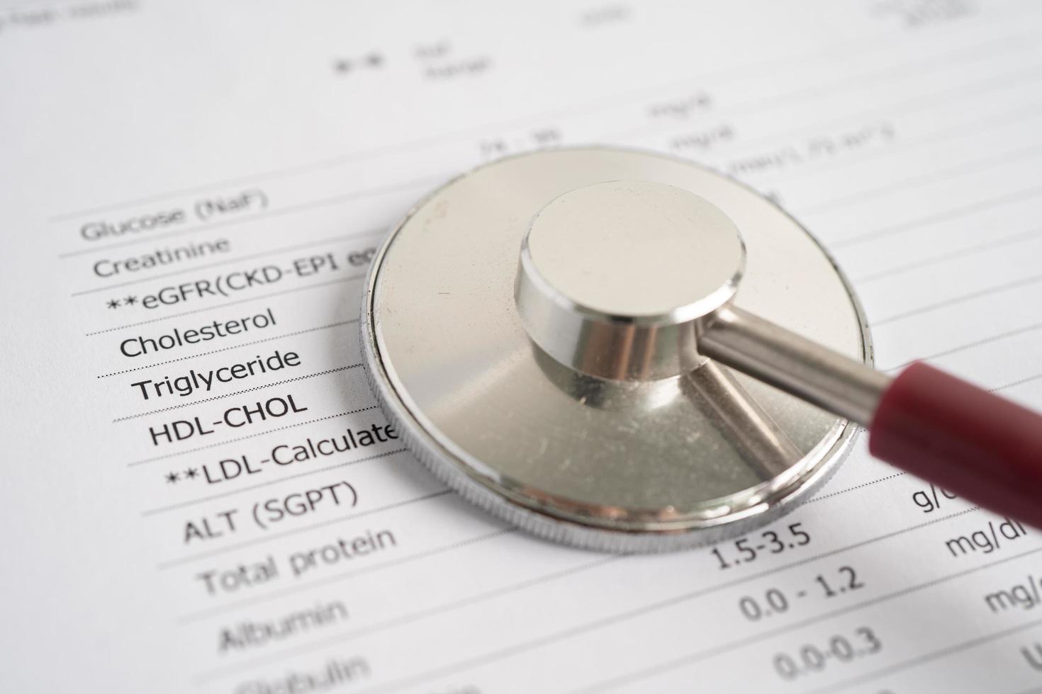 Diagnosis lab request form, Form the result of biochemistry blood test with stethoscope. photo