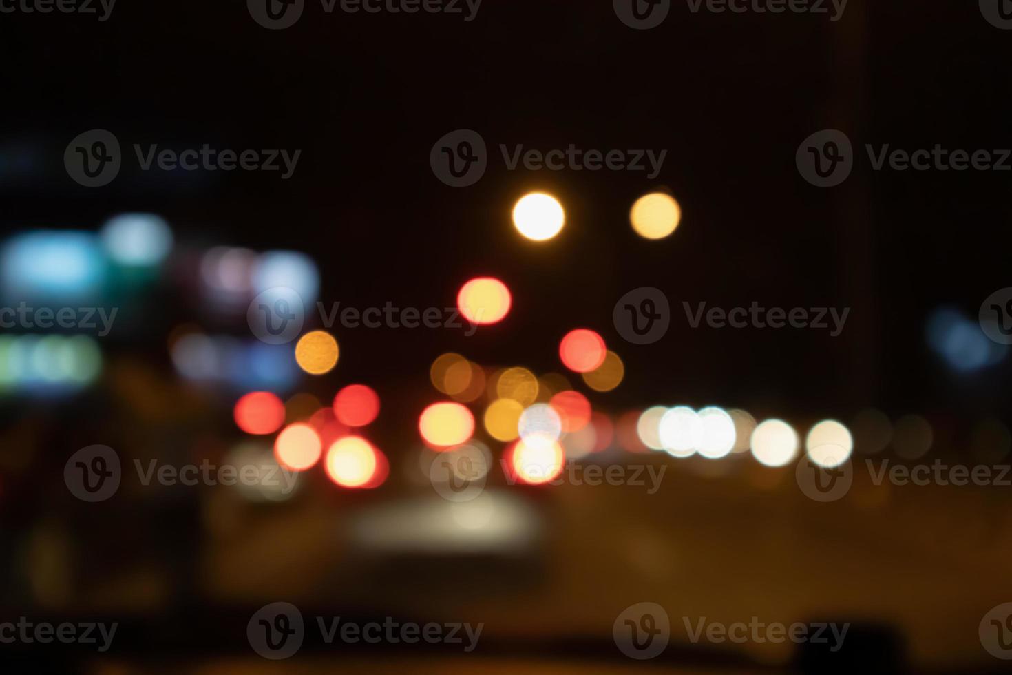 Abstract night traffic blur background with bokeh light photo