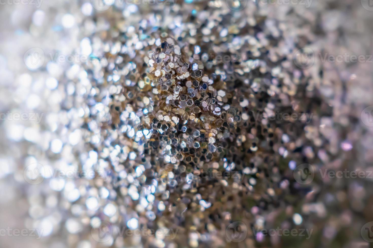 Abstract blur silver glitter sparkle defocused bokeh light background photo