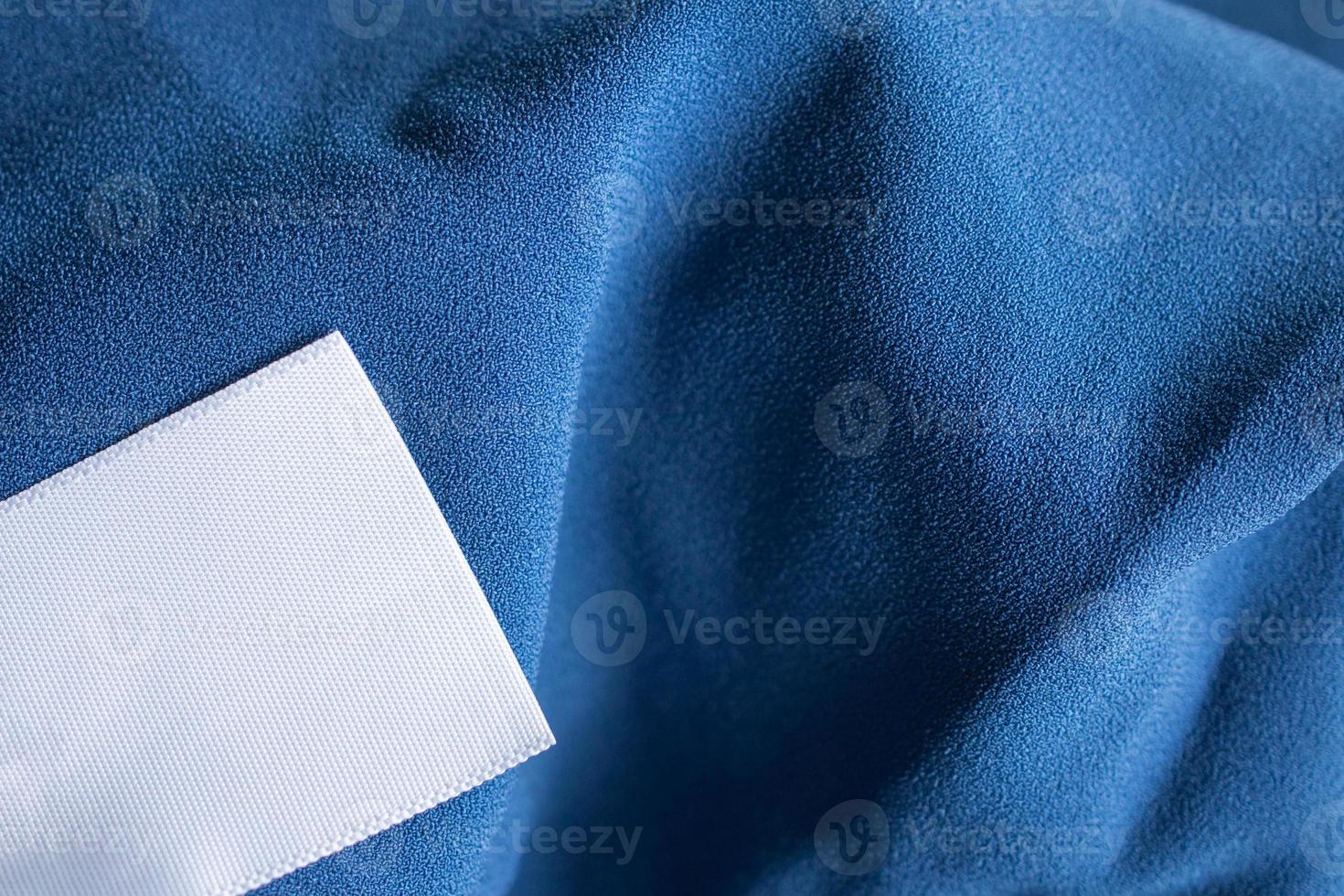 laundry care clothing label on blue dress photo