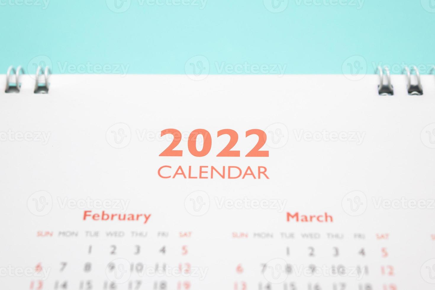 2022 calendar page on blue background business planning appointment meeting concept photo