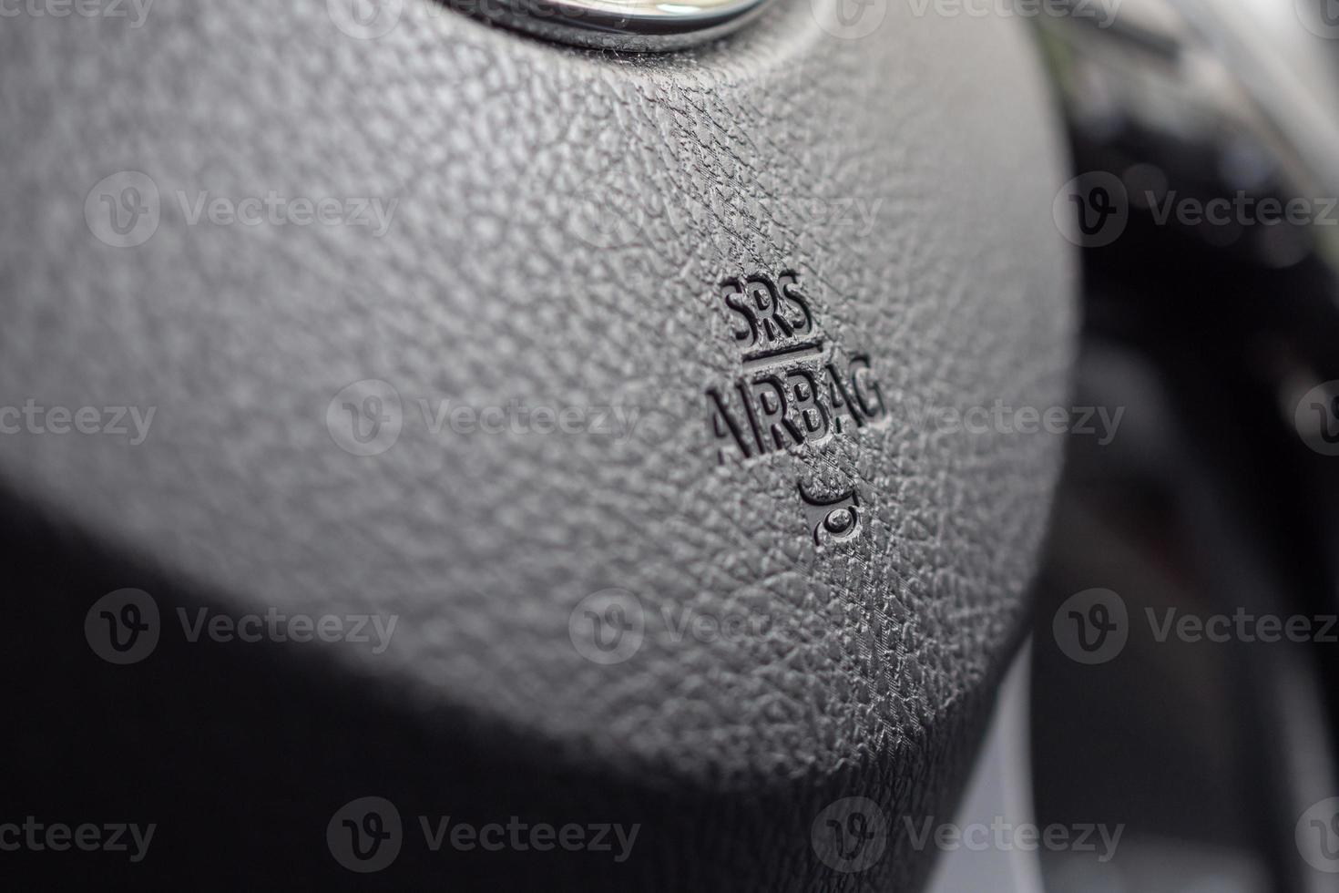 Safety airbag sign on car steering wheel with horn icon photo