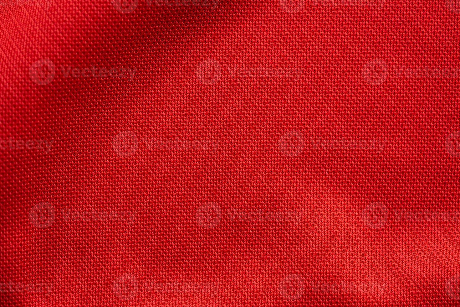 Red sports clothing fabric football jersey texture close up photo