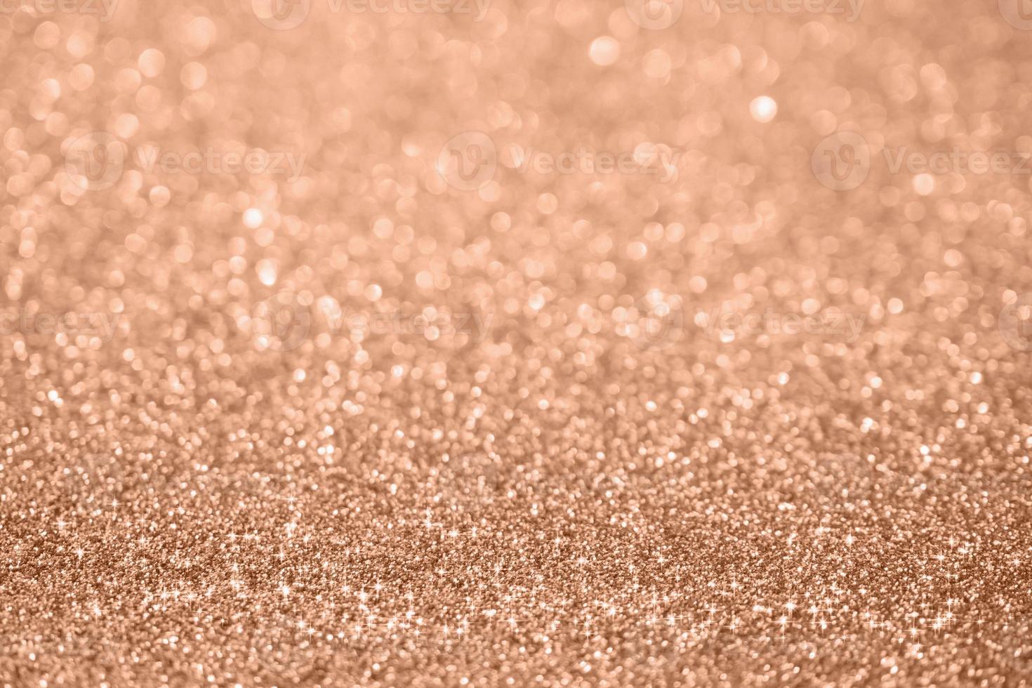 Abstract blur rose gold glitter sparkle defocused bokeh light background photo