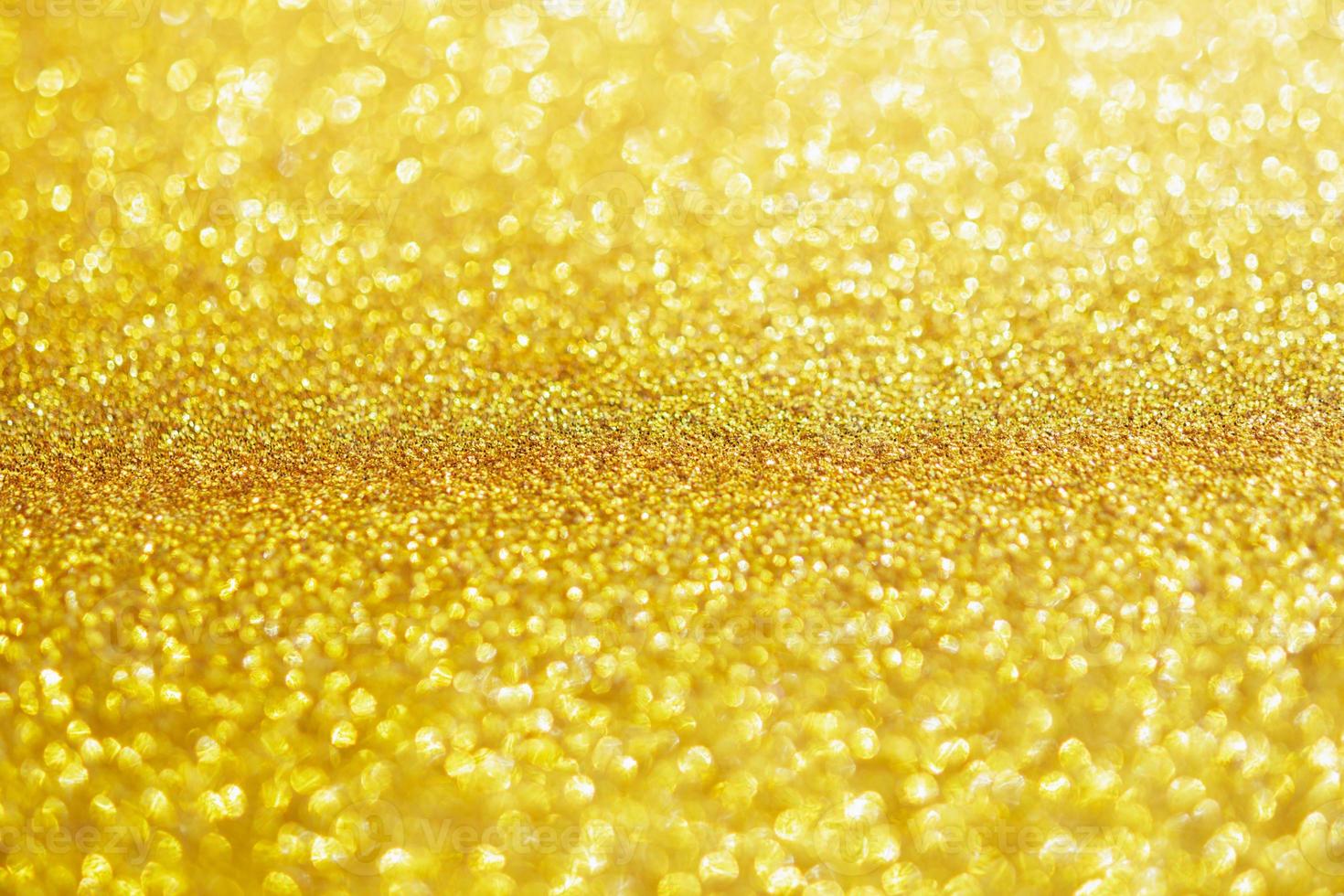 Abstract gold glitter sparkle with bokeh light background photo