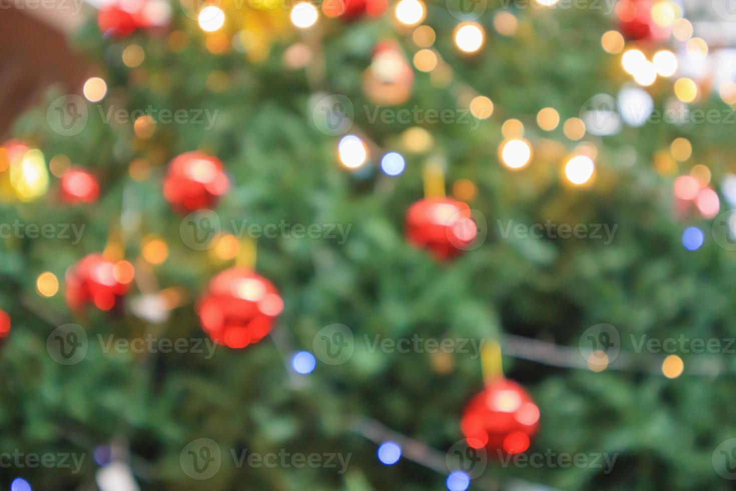 Abstract christmas holiday with festive gold bokeh light on tree blurred background photo