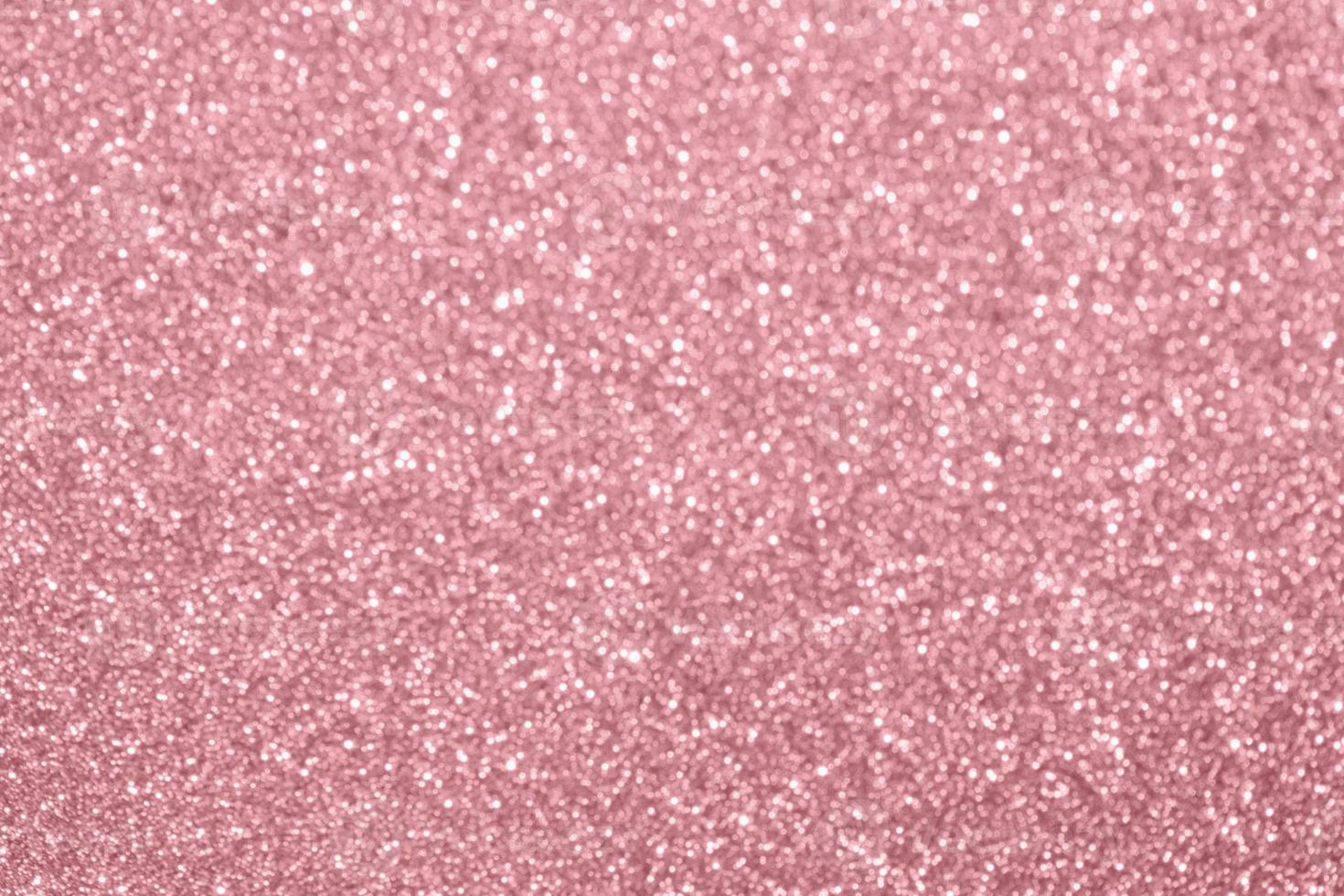 Abstract blur rose gold glitter sparkle defocused bokeh light background photo