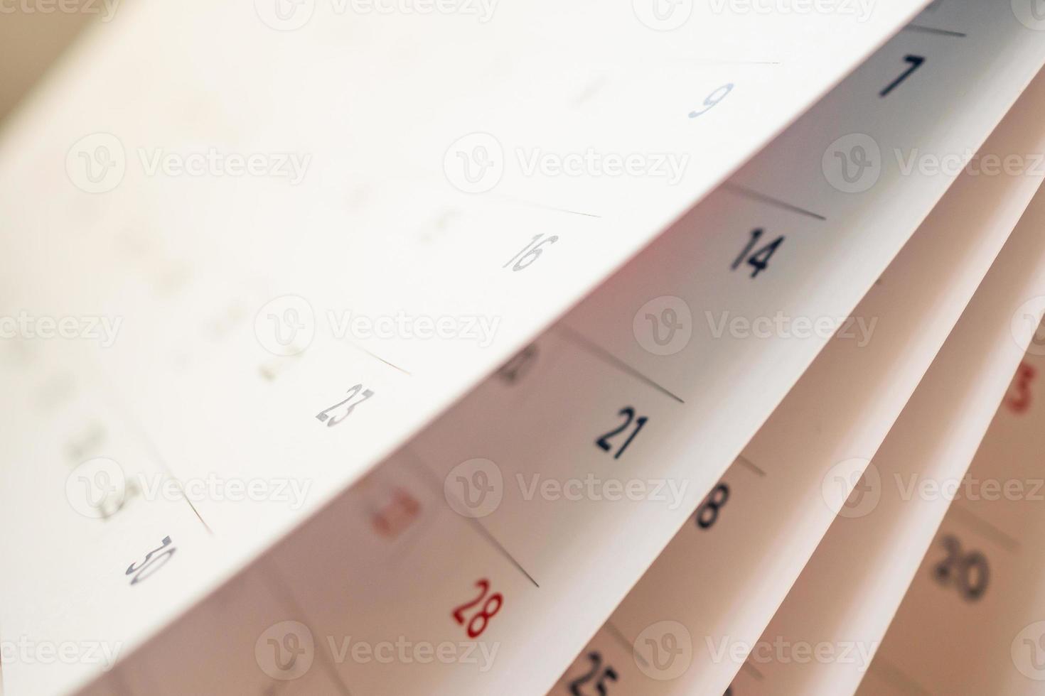 Abstract blur calendar page flipping sheet close up background photo