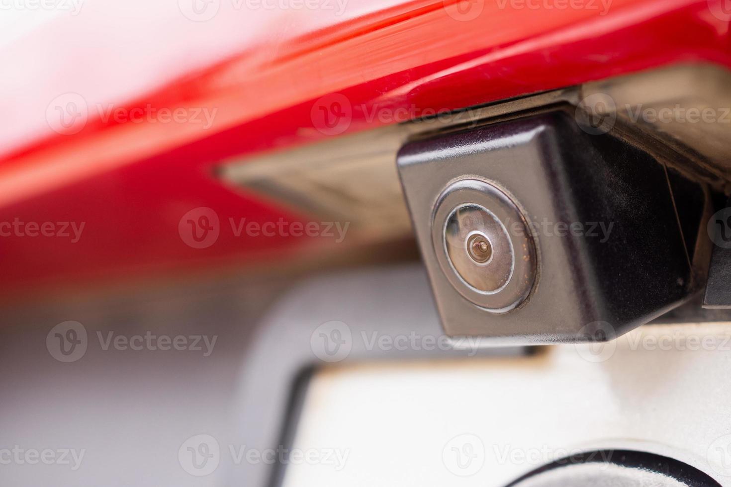 Red car rear view camera close up for parking assistance photo