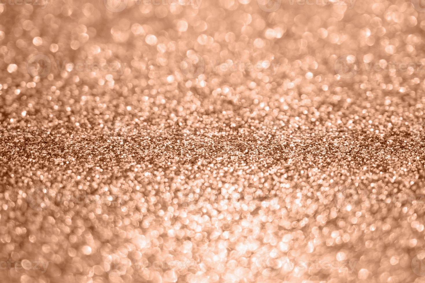 Abstract blur rose gold glitter sparkle defocused bokeh light background photo