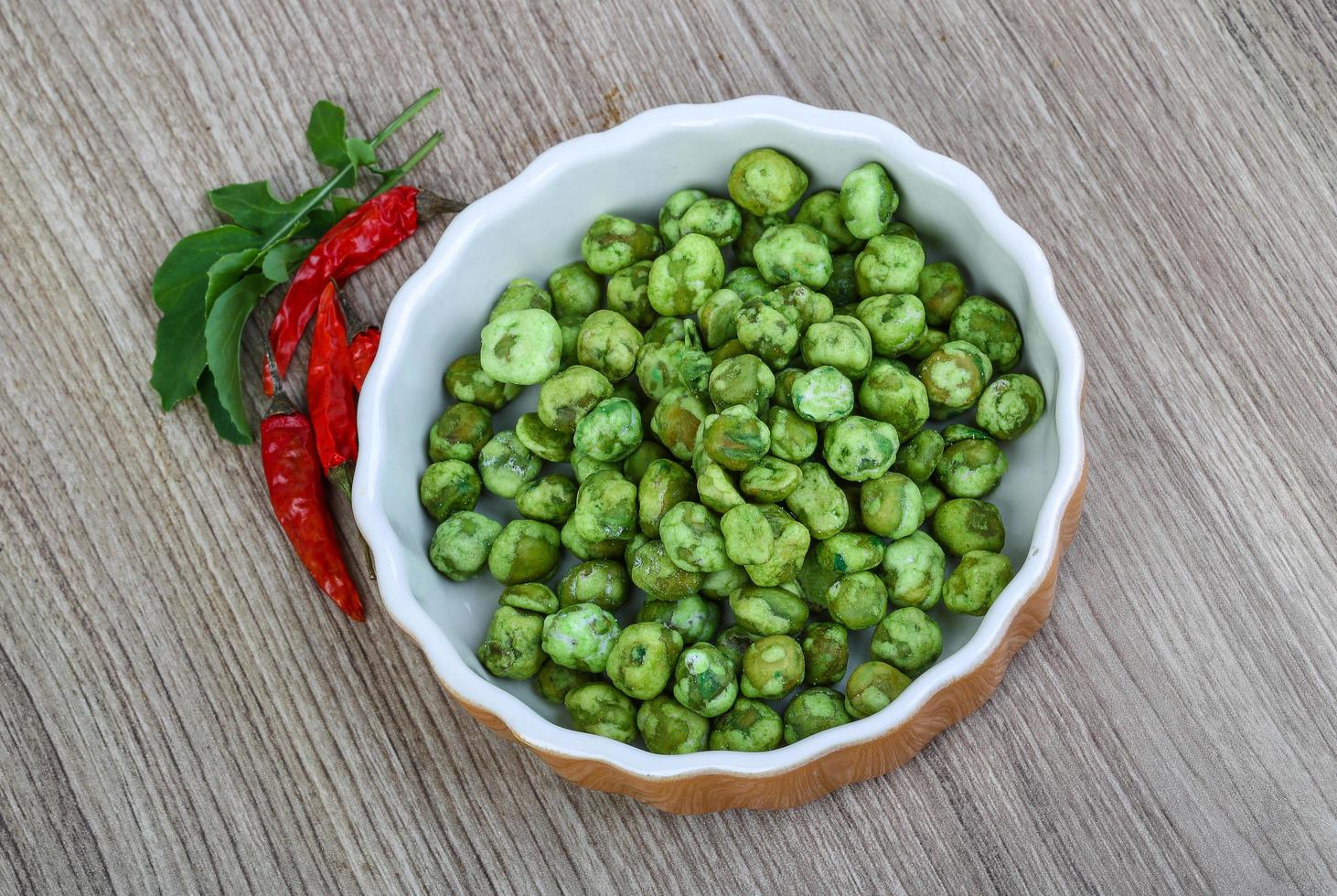 Wasabi peas on wood photo