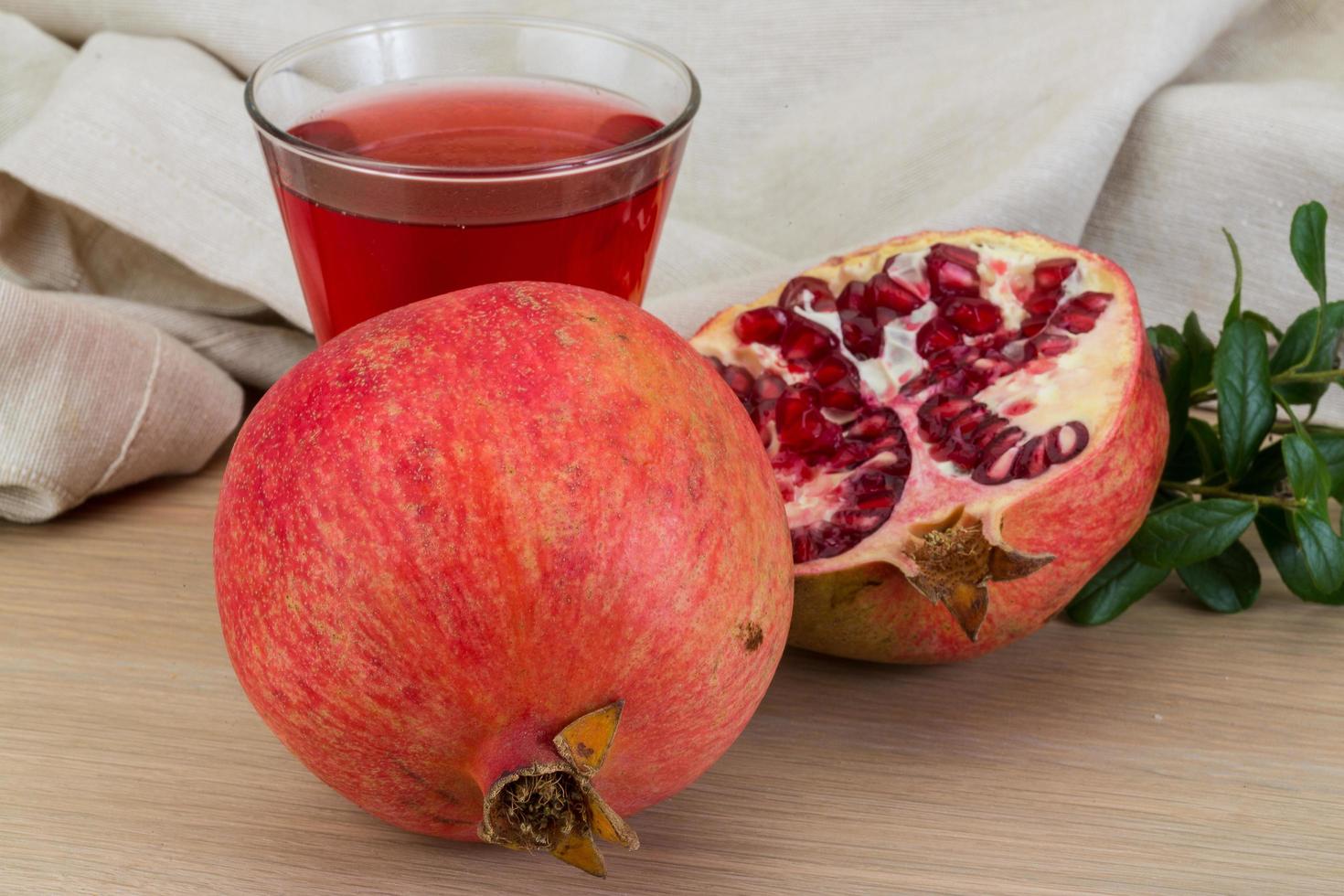 Pomegranate juice on wood photo