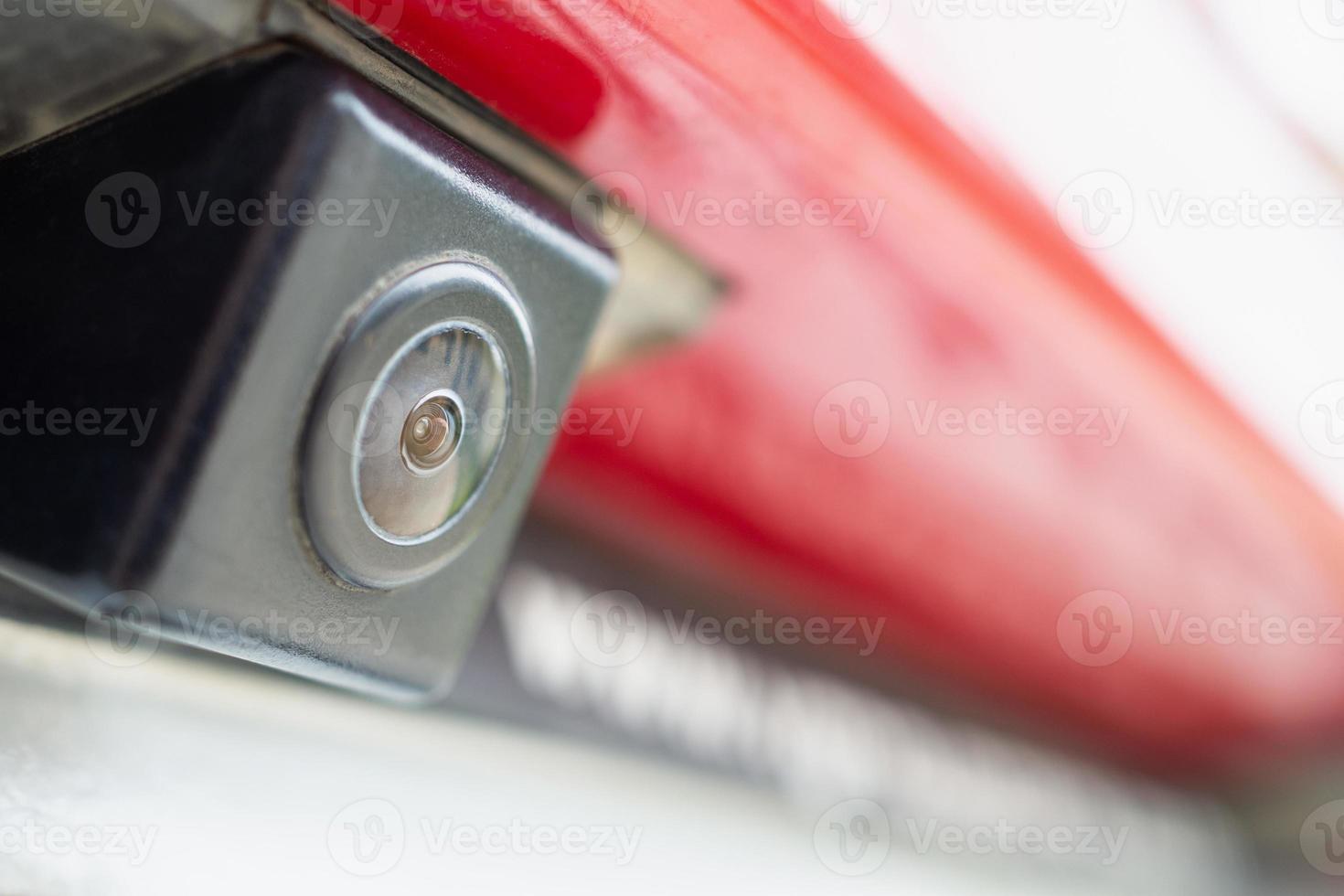 Red car rear view camera close up for parking assistance photo
