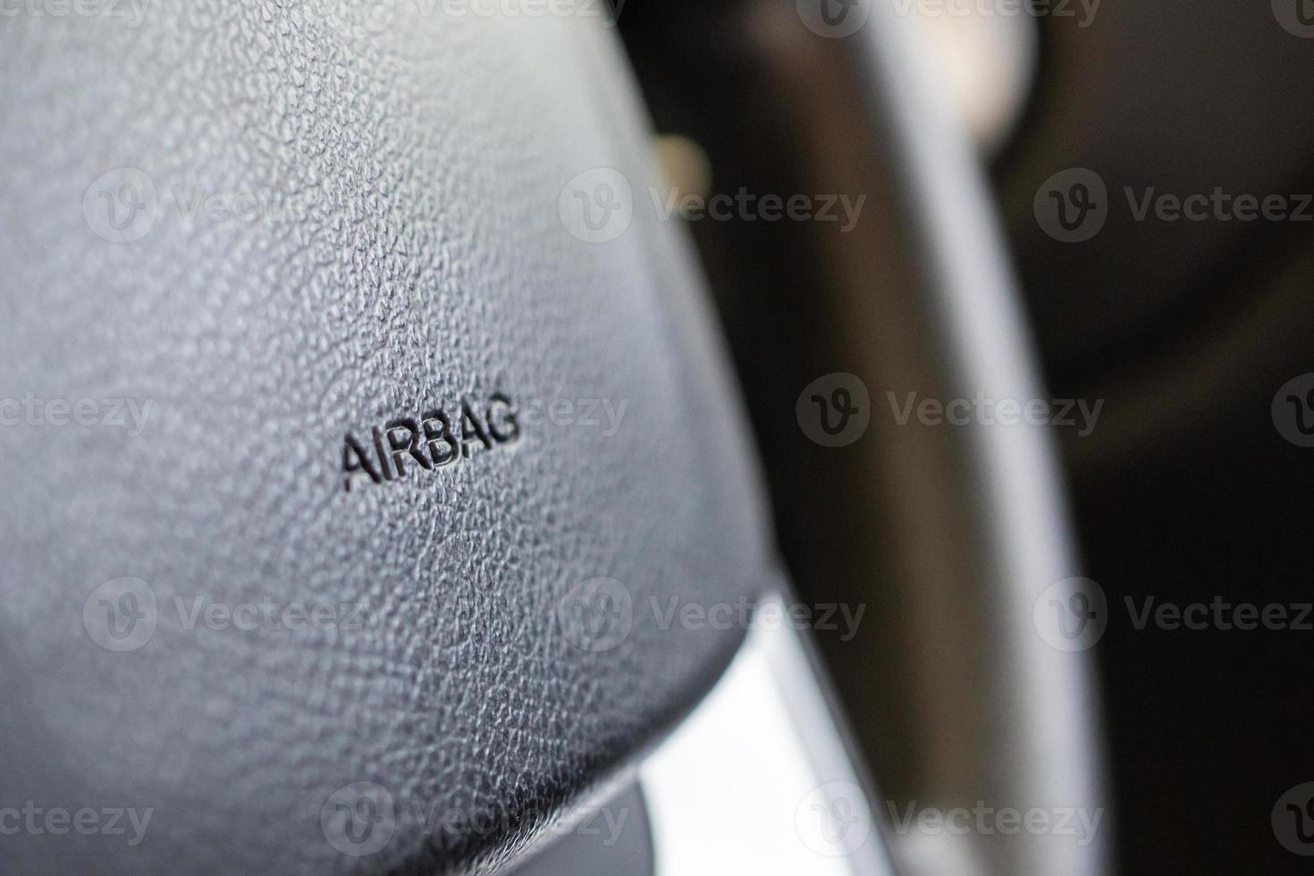 Safety airbag sign on car steering wheel photo