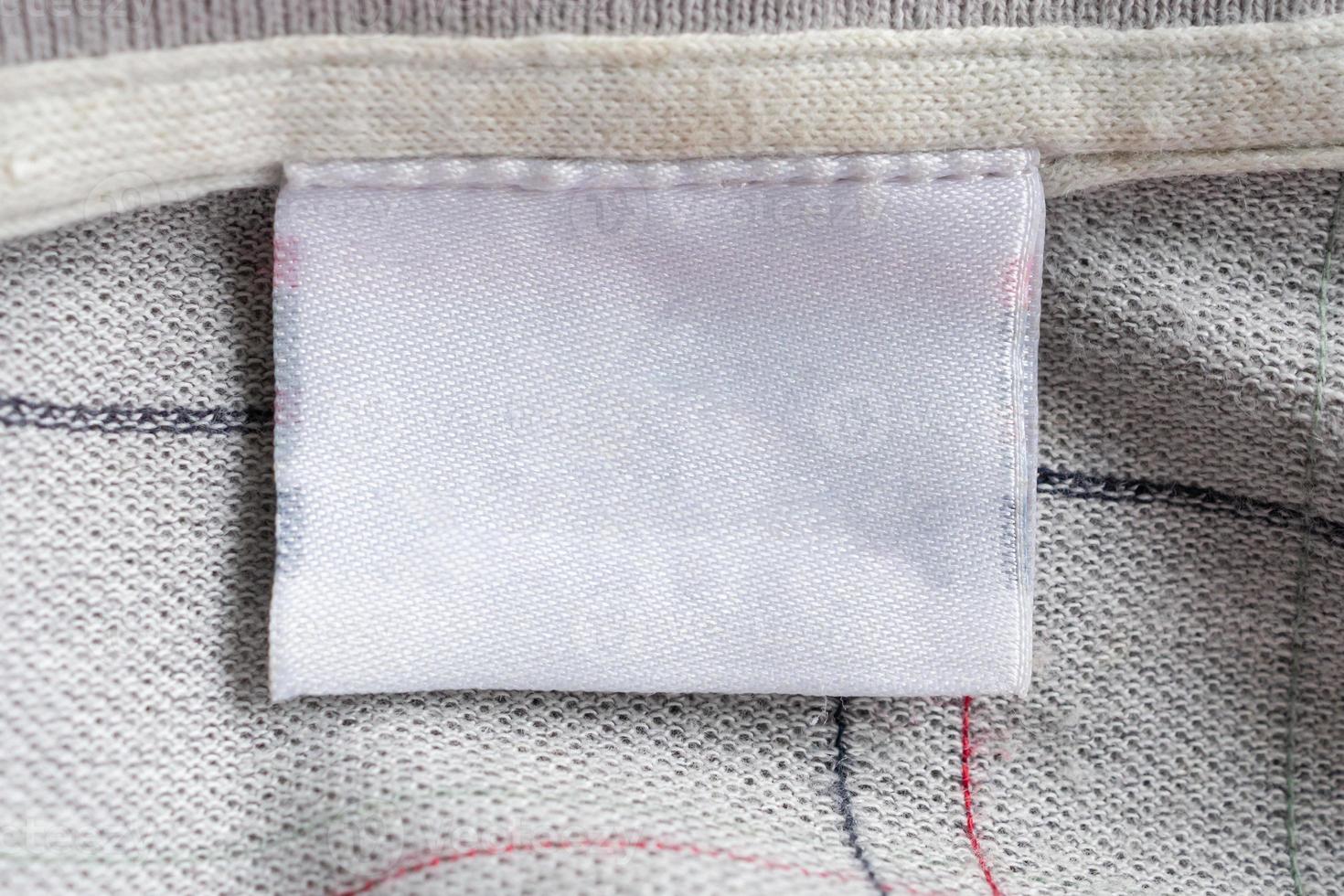 laundry care clothing label on fabric texture photo