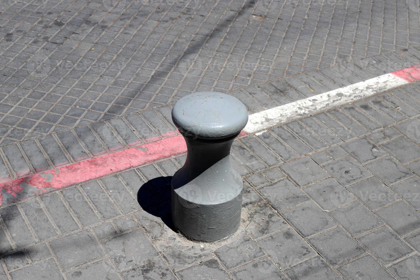 Road barriers along the sidewalk for the safe passage of pedestrians. photo