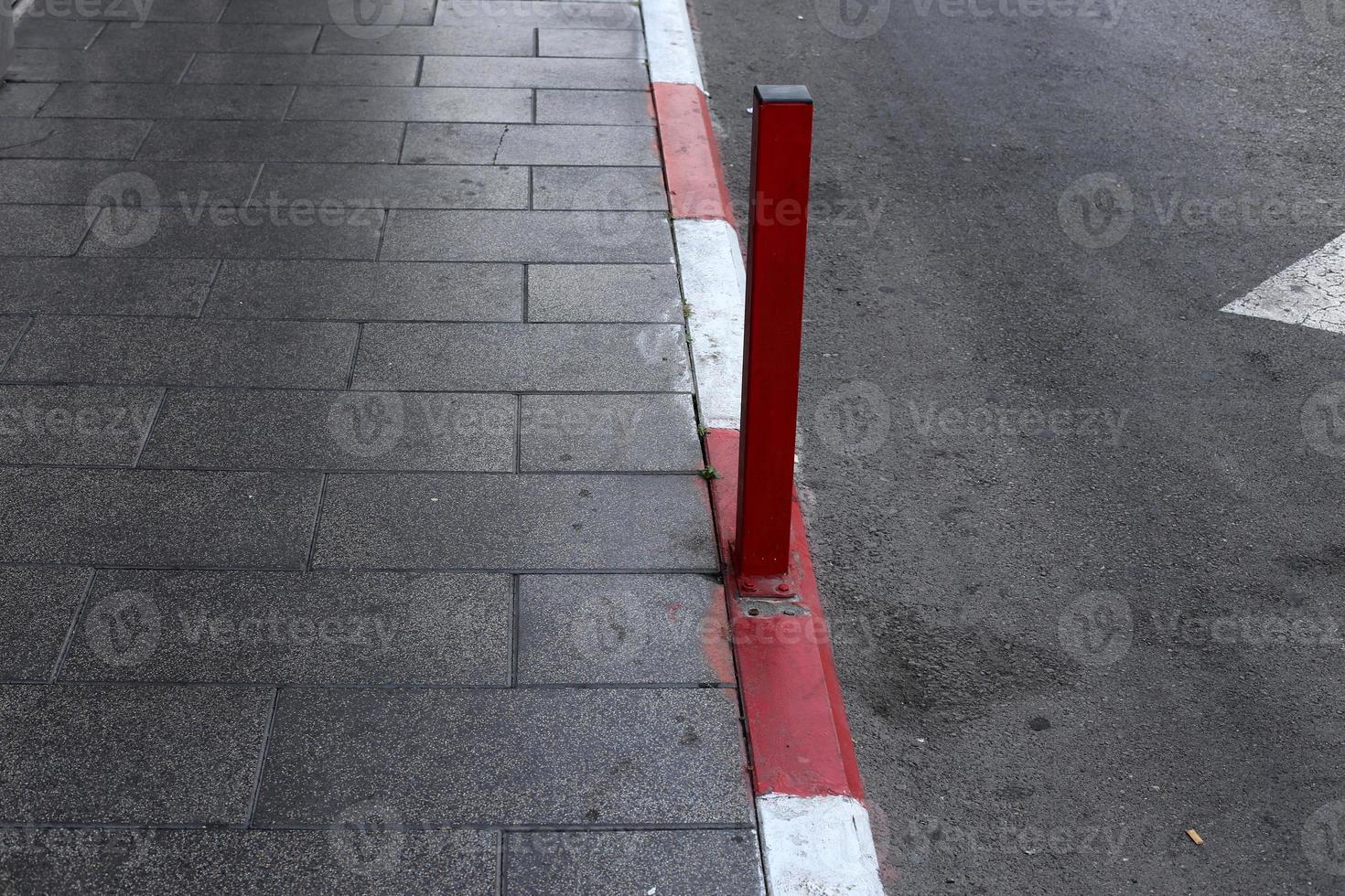 Road barriers along the sidewalk for the safe passage of pedestrians. photo
