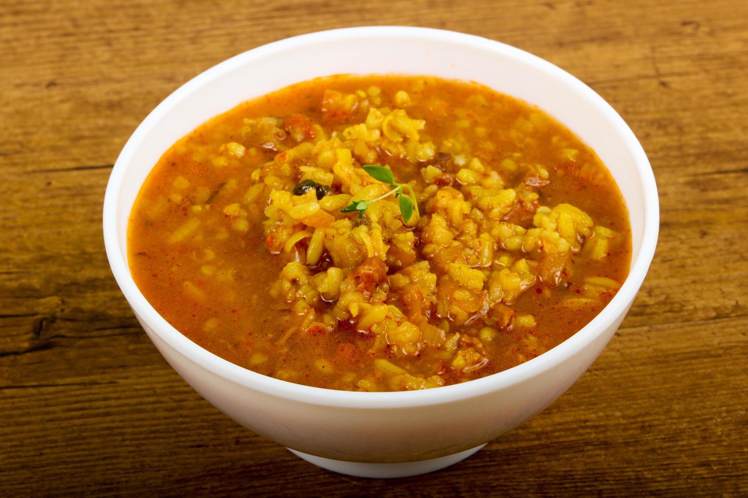Kharcho soup in a bowl on wooden background photo