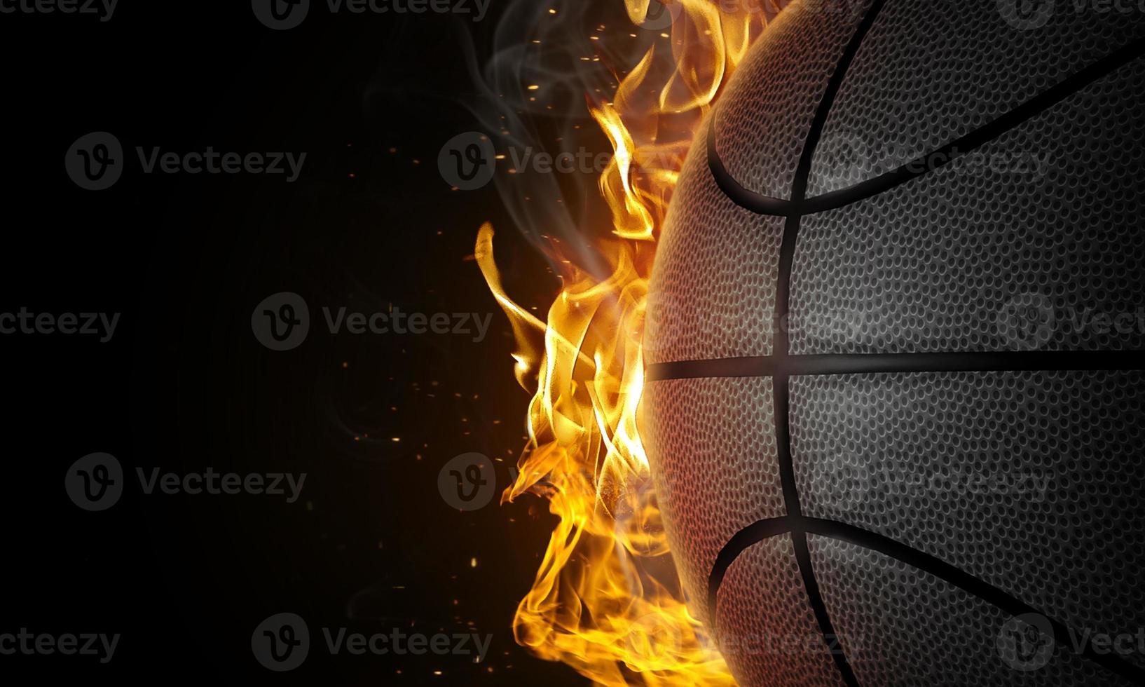 Basketball on fire on black background photo