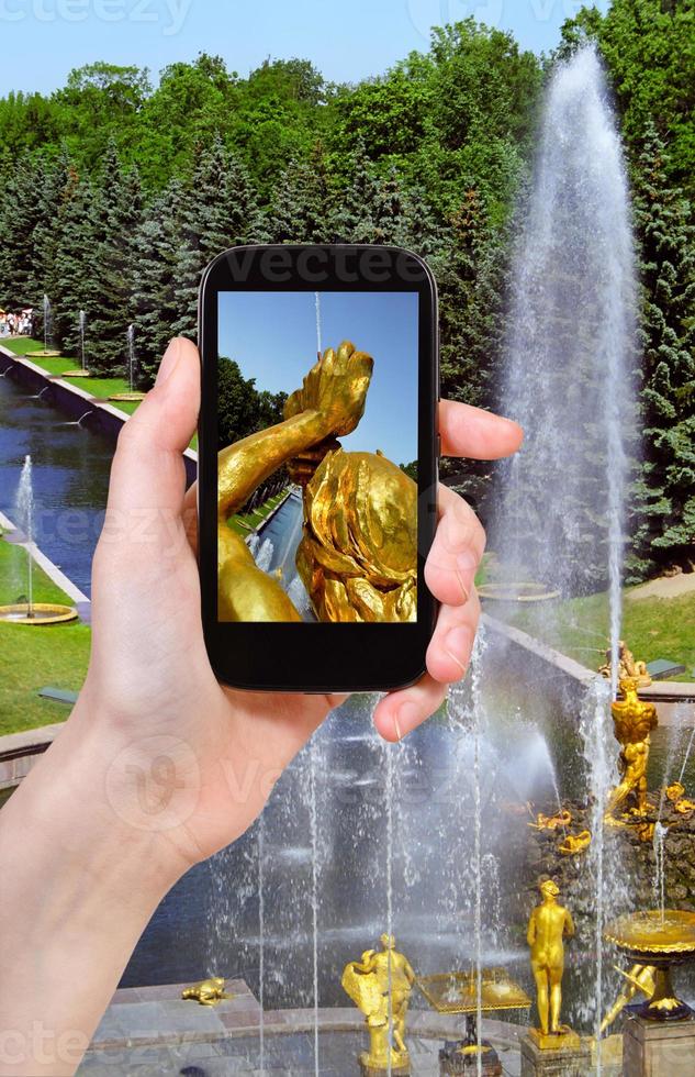 tourist taking photo of Samson Fountain