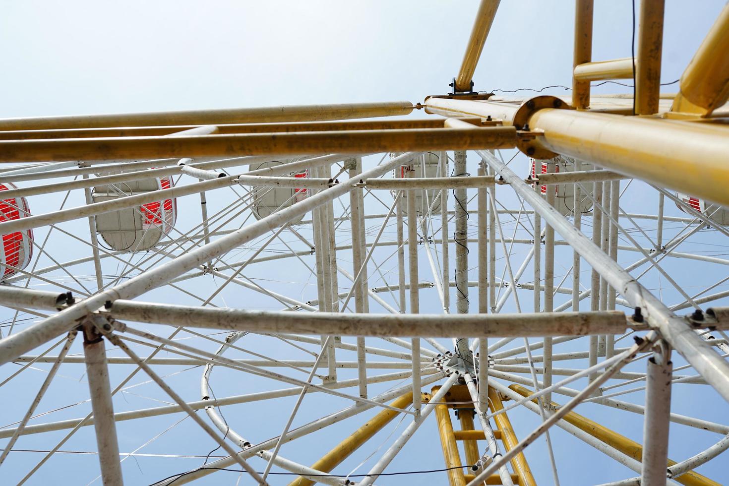 carnival, Ferris wheel over blue sky in amusement park in summer photo