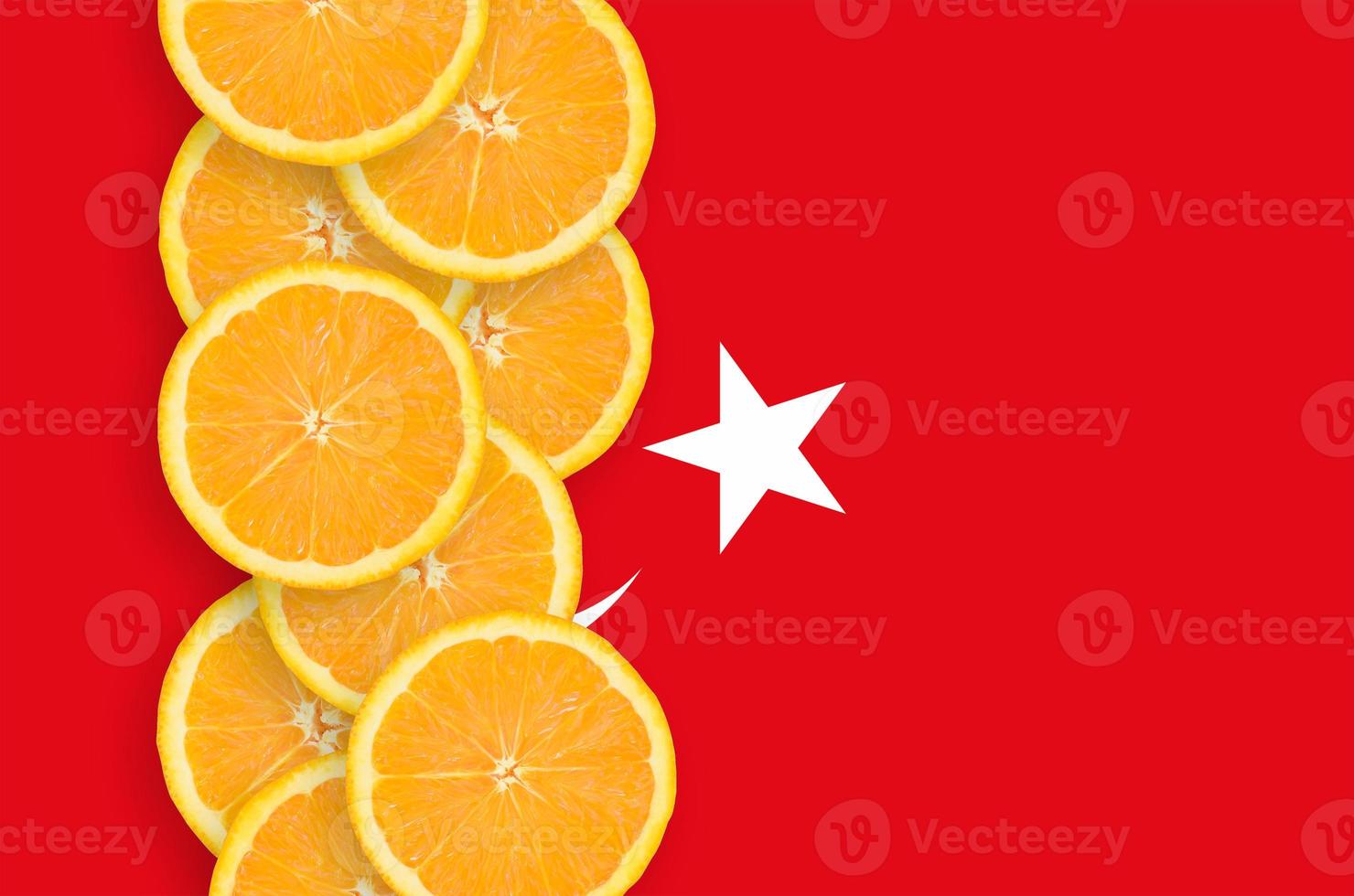 Turkey flag and citrus fruit slices vertical row photo