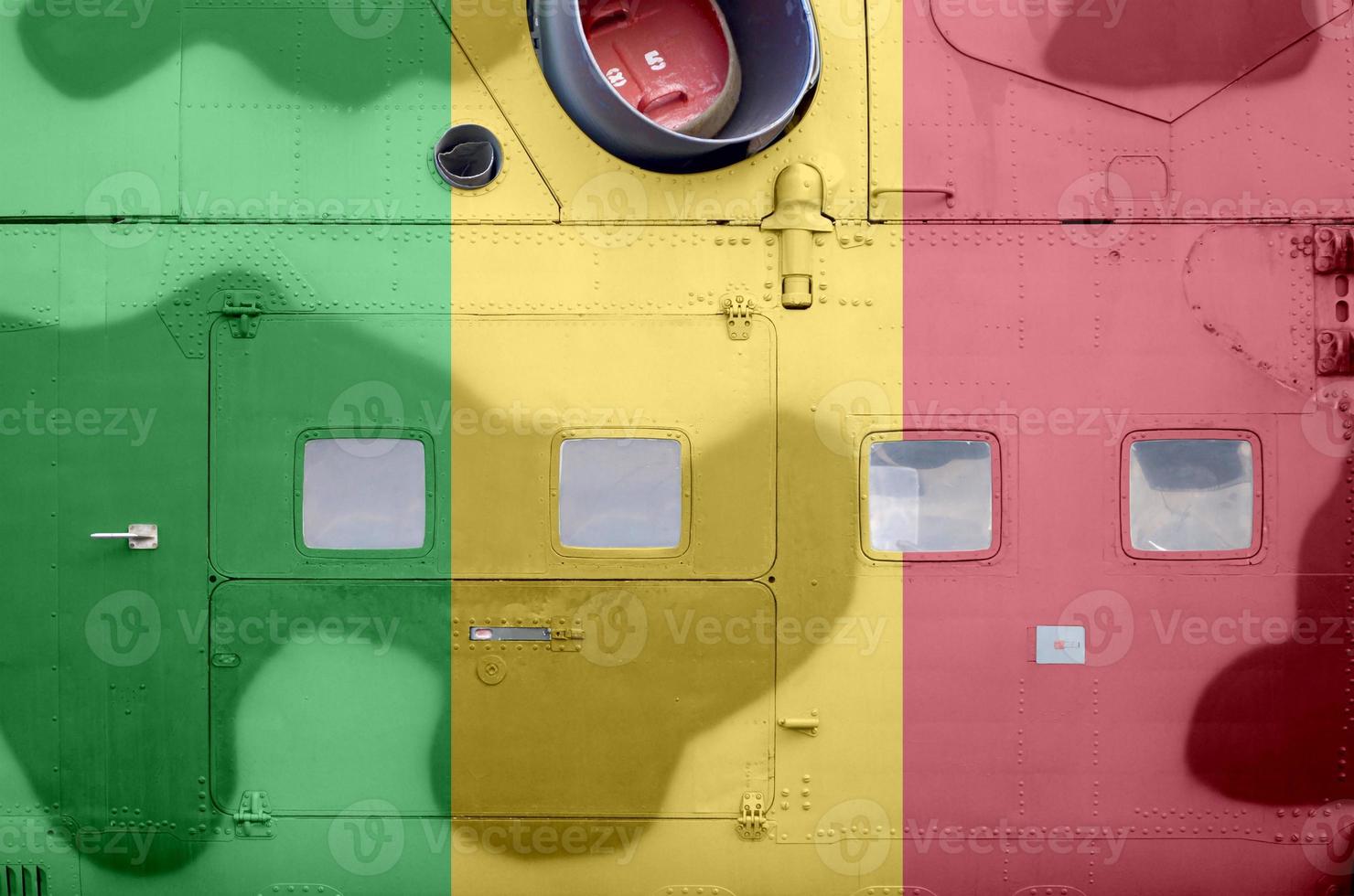 Mali flag depicted on side part of military armored helicopter closeup. Army forces aircraft conceptual background photo