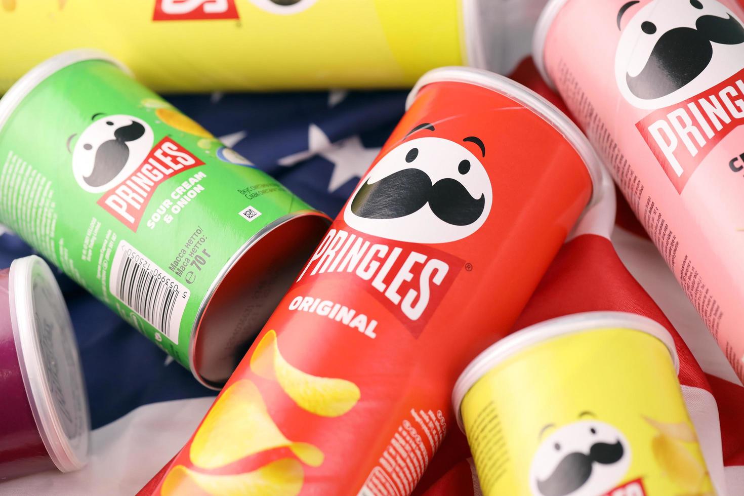 KHARKIV, UKRAINE - DECEMBER 16, 2021 Pringles product with new logo. Pringles is a brand of potato snack chips owned by the Kellogg Company photo