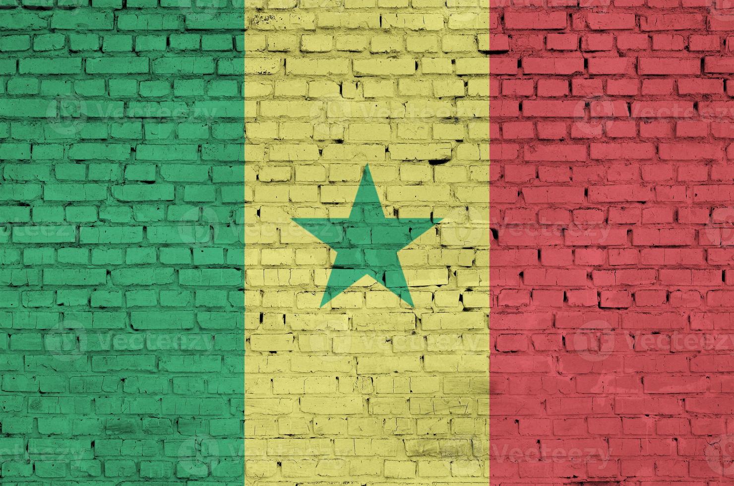 Senegal flag is painted onto an old brick wall photo