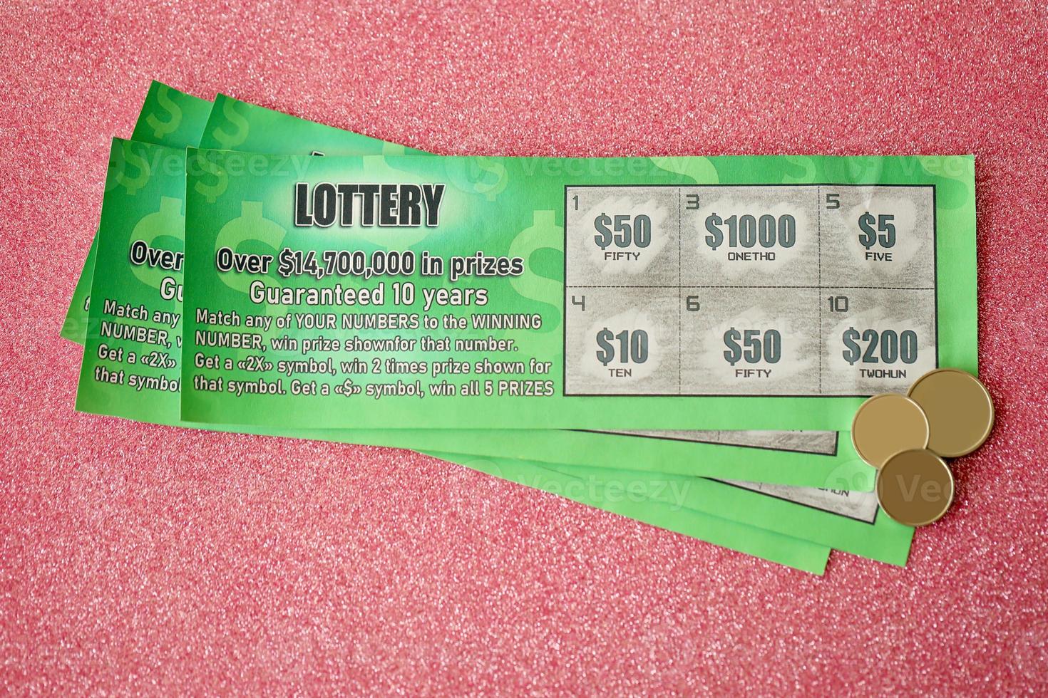 Close up view of green lottery scratch cards. Many used fake instant lottery tickets with gambling results. Gambling addiction photo